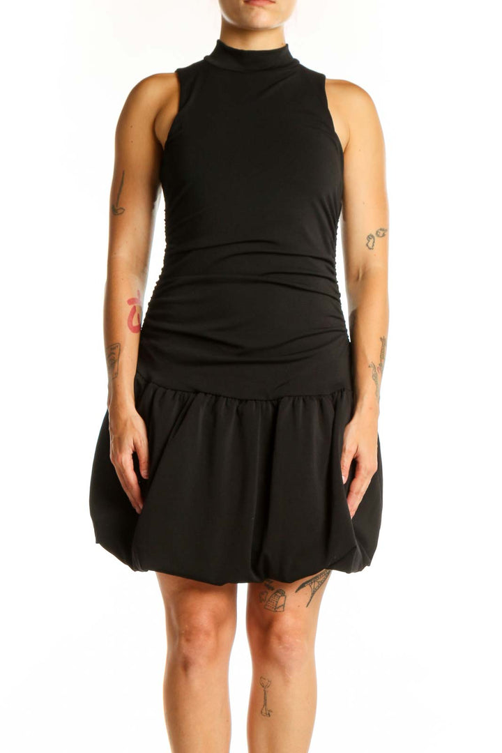 Black ruched bubble hem dress with mock turtleneck and sleeveless design, front view