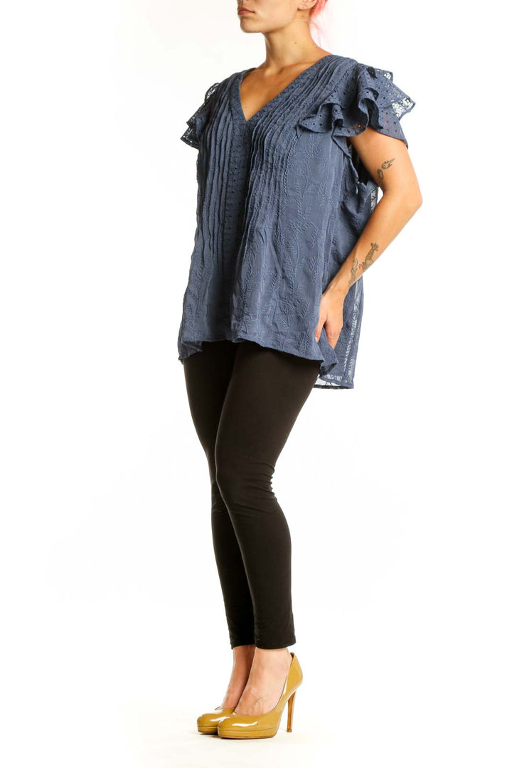 Blue pleated top with ruffled lace short sleeves and V-neckline, front view