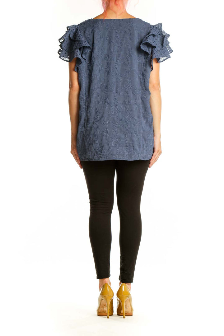 Blue pleated top with ruffled lace short sleeves, back view