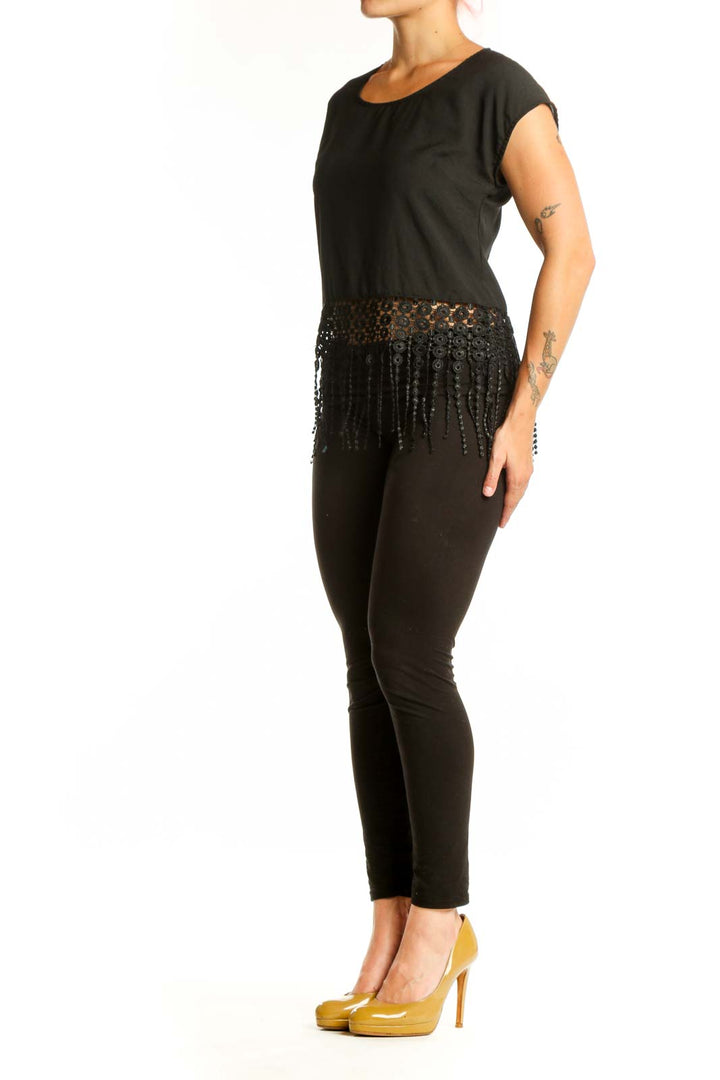 Black beaded fringe crop top front view showing beadwork and fringe detailing at waist