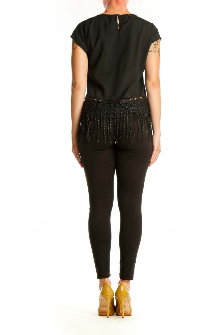 Black beaded fringe crop top back view displaying cascading beaded fringe trim