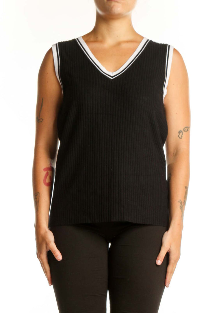 Black ribbed V-neck knit tank with white contrast trim, front view on model