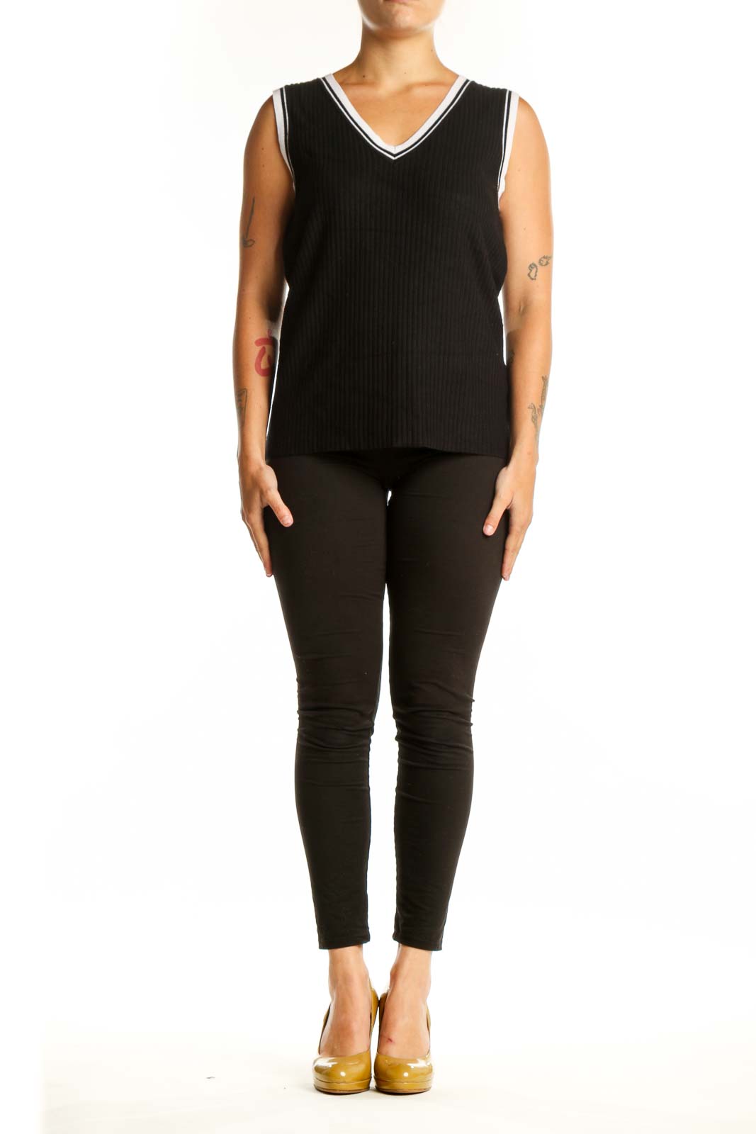 Black ribbed V-neck knit tank with white contrast trim, front view on model