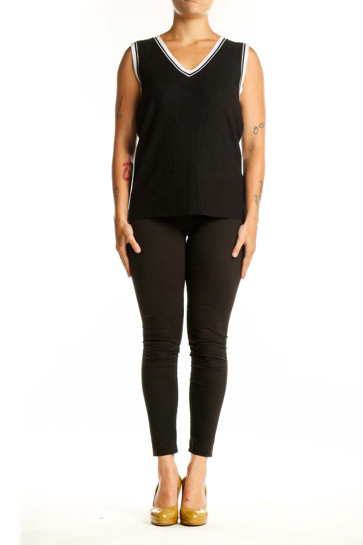 Black ribbed V-neck knit tank with white contrast trim, front view on model