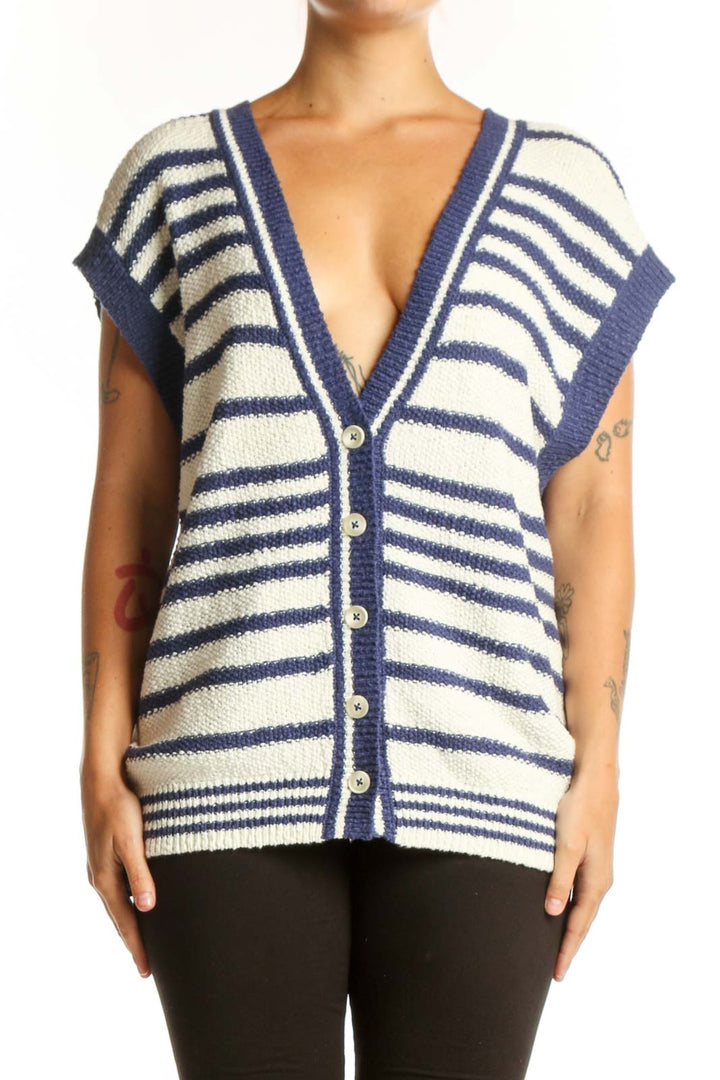 Navy and cream striped Maeve cardigan vest with button-front closure and V-neckline, worn with black pants