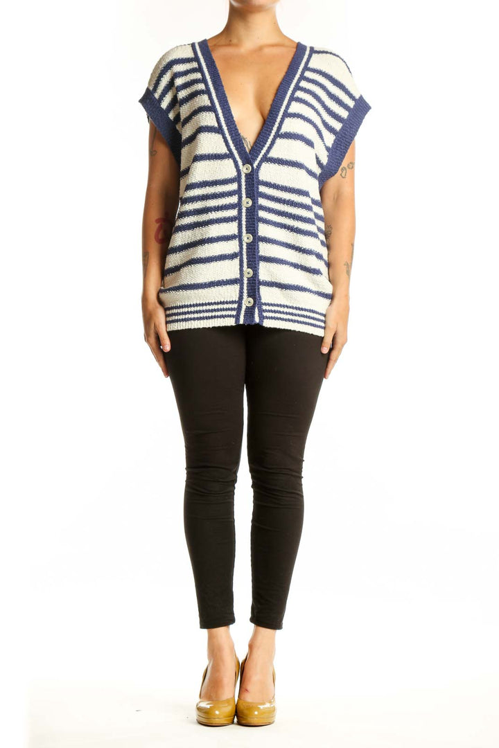 Navy and cream striped Maeve cardigan vest with button-front closure and V-neckline, worn with black pants
