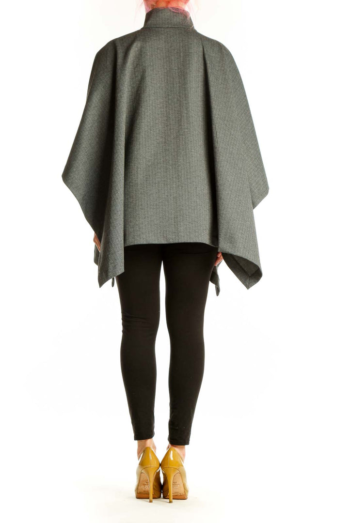 Back view of gray wool blend cape jacket showing asymmetrical hemline and flowing draped design