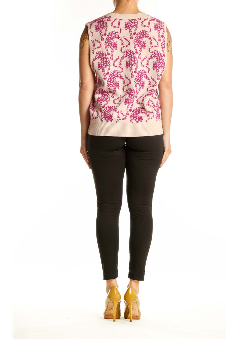 Back view of pink elephant print knit vest showing sleeveless design and ribbed trim