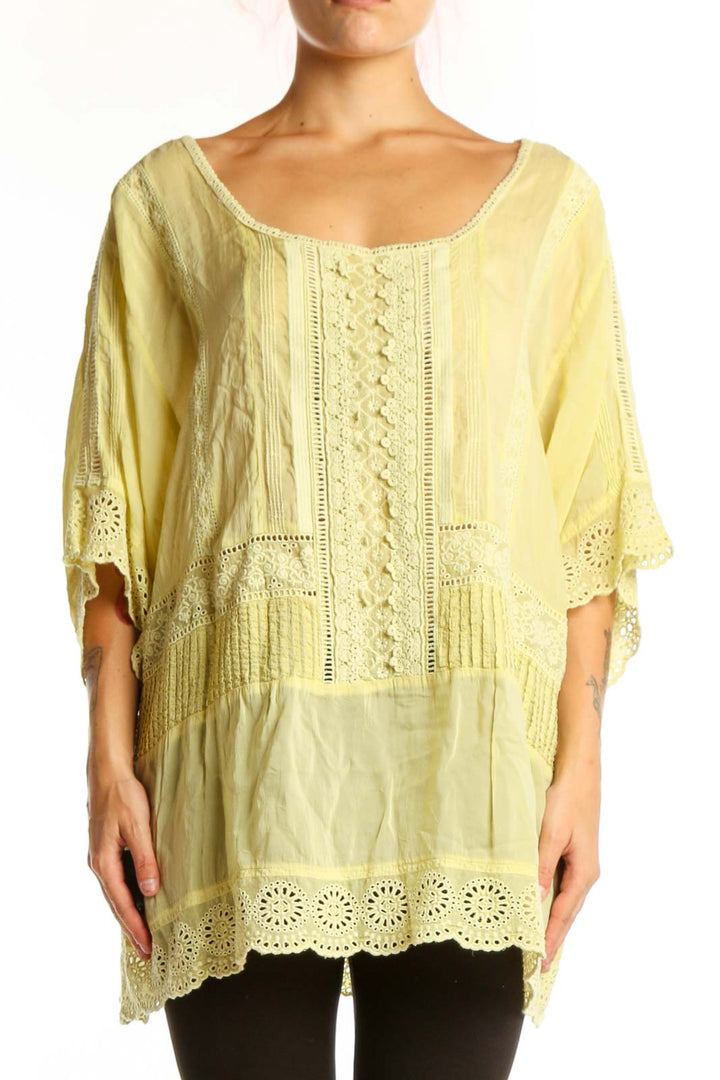 Pale yellow rayon tunic top with embroidered center panel and eyelet lace detailing, front view