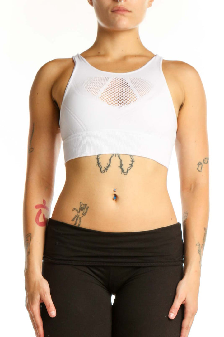 White mesh cutout sports bra with racerback design, front view on model