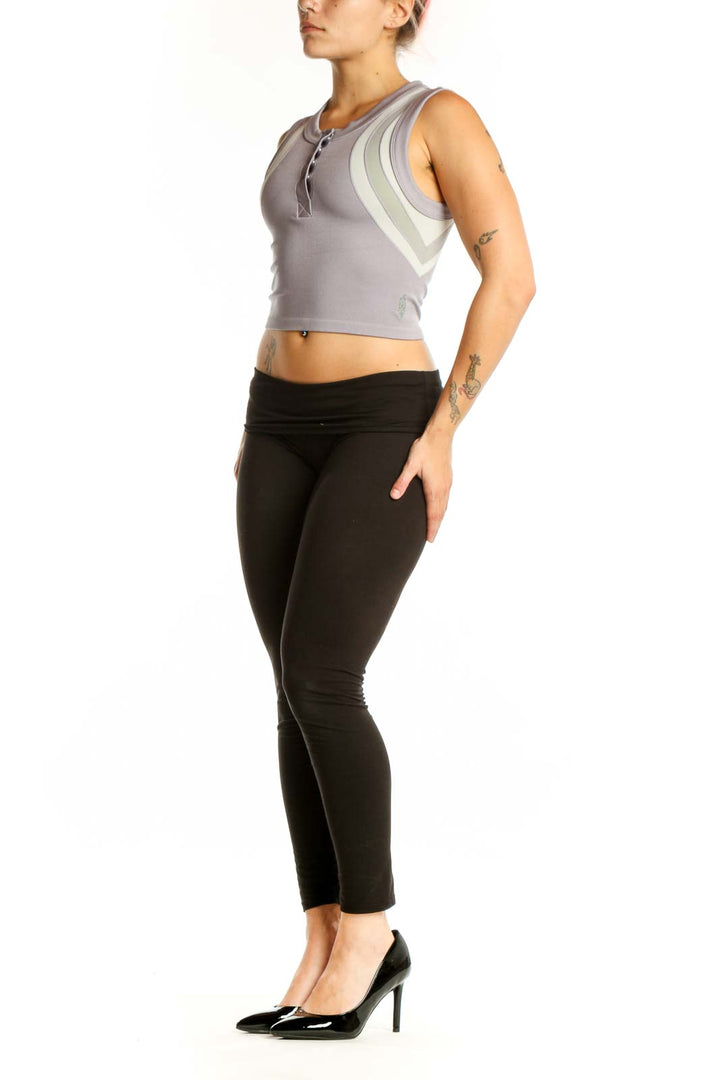 Gray and cream striped crop tank top with color-block design, front view