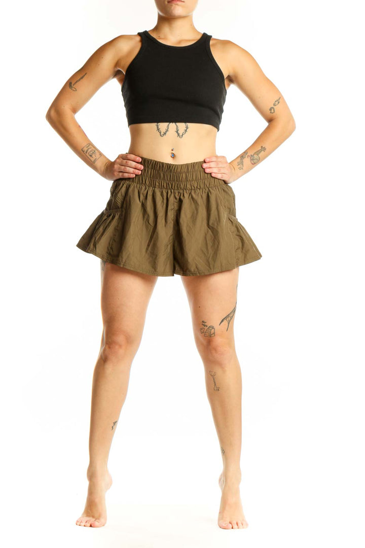 Olive green ruched athletic skirt with elastic waistband, front view showing flowy design and gathered construction