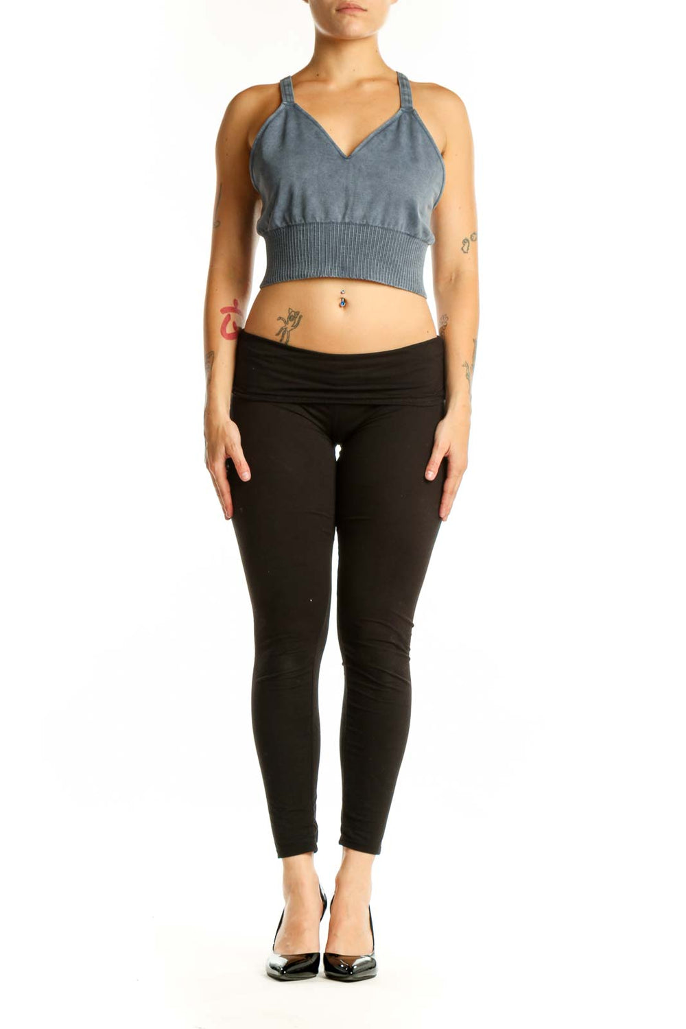 Blue ribbed crop tank top with V-neckline and adjustable straps, front view on model