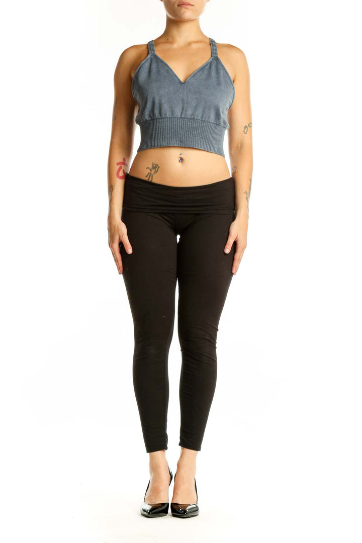Blue ribbed crop tank top with V-neckline and adjustable straps, front view on model
