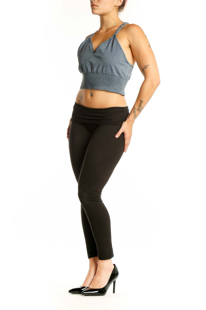 Blue ribbed crop tank top with V-neckline and adjustable straps, front view on model