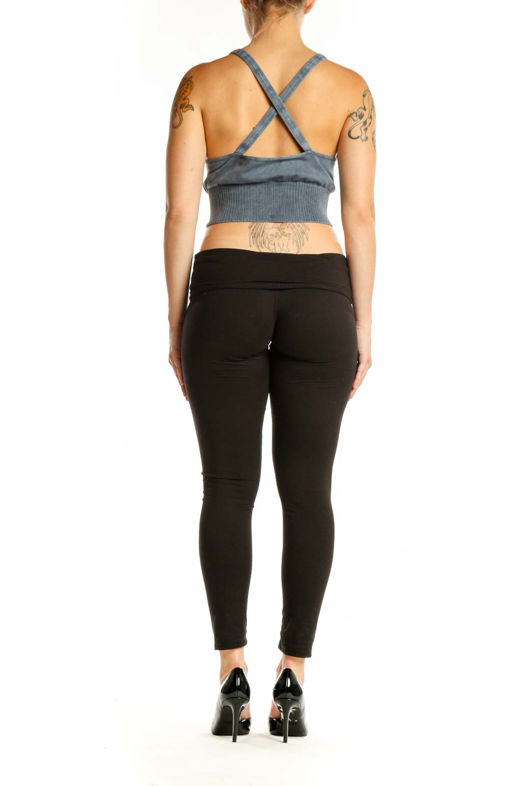 Blue ribbed crop tank top with adjustable straps, back view on model