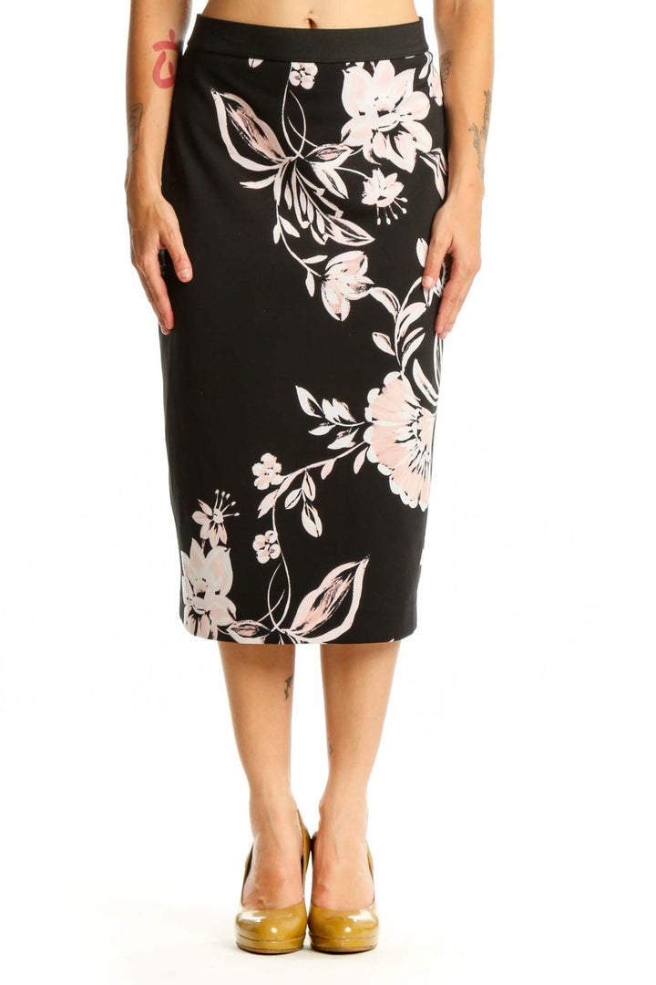 Black pencil skirt with white and pink floral botanical print, front view