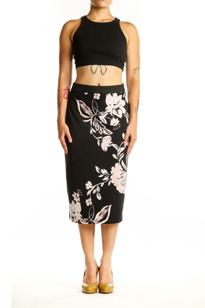 Black pencil skirt with white and pink floral botanical print, front view