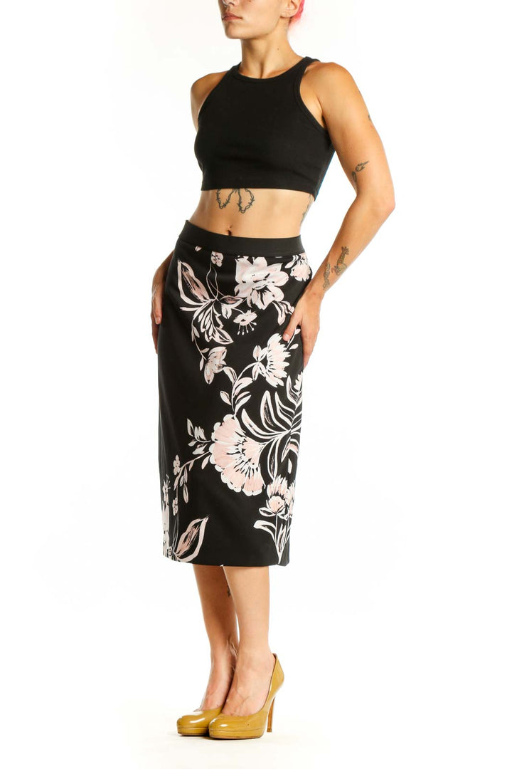 Black pencil skirt with white and pink floral botanical print, front view