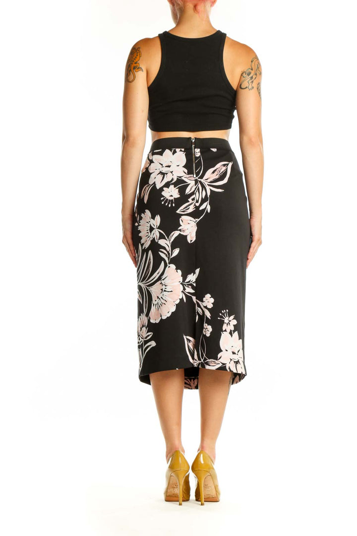 Black pencil skirt with white and pink floral botanical print, back view