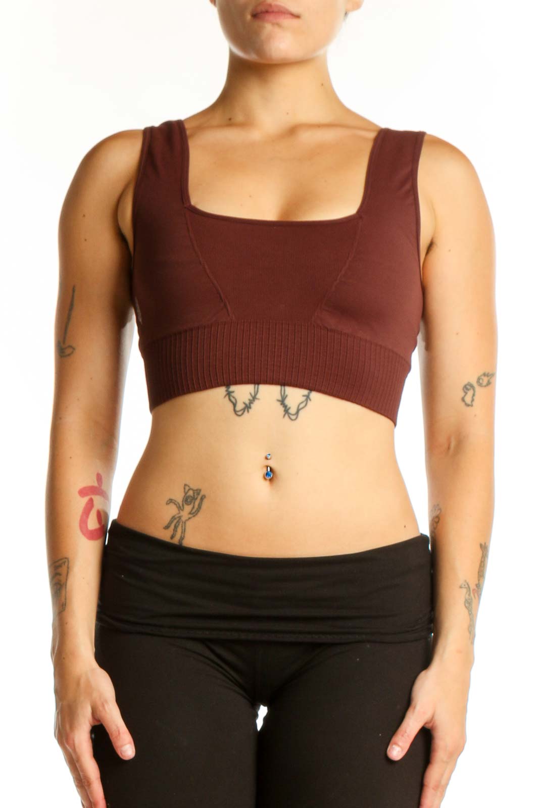 Front view of burgundy ribbed sports bra tank top with square neckline and black leggings