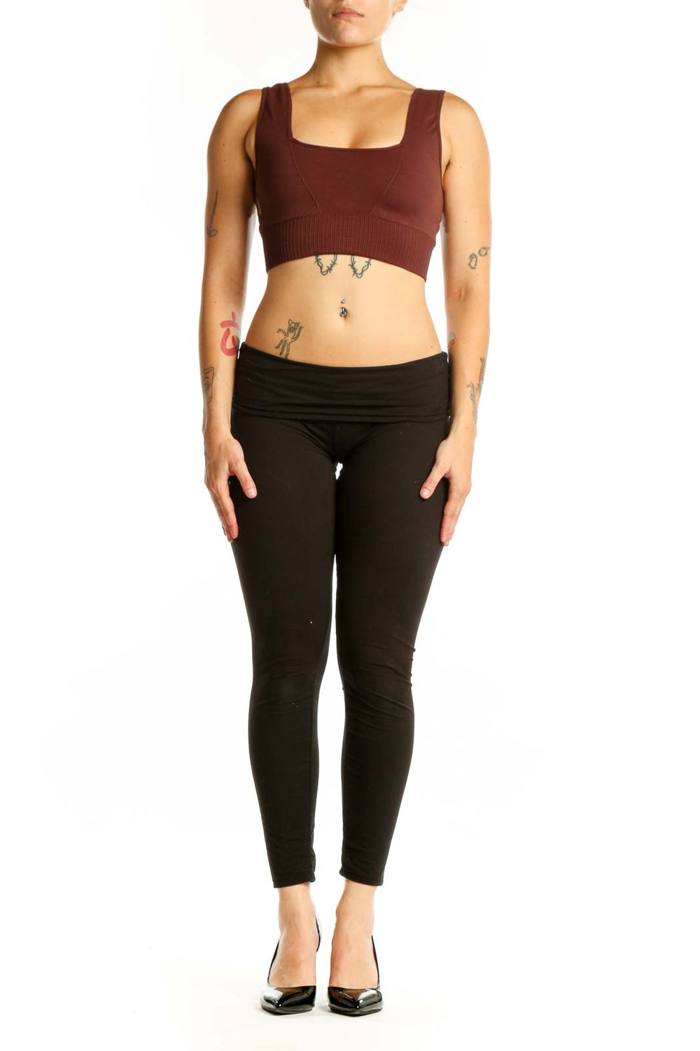 Front view of burgundy ribbed sports bra tank top with square neckline and black leggings
