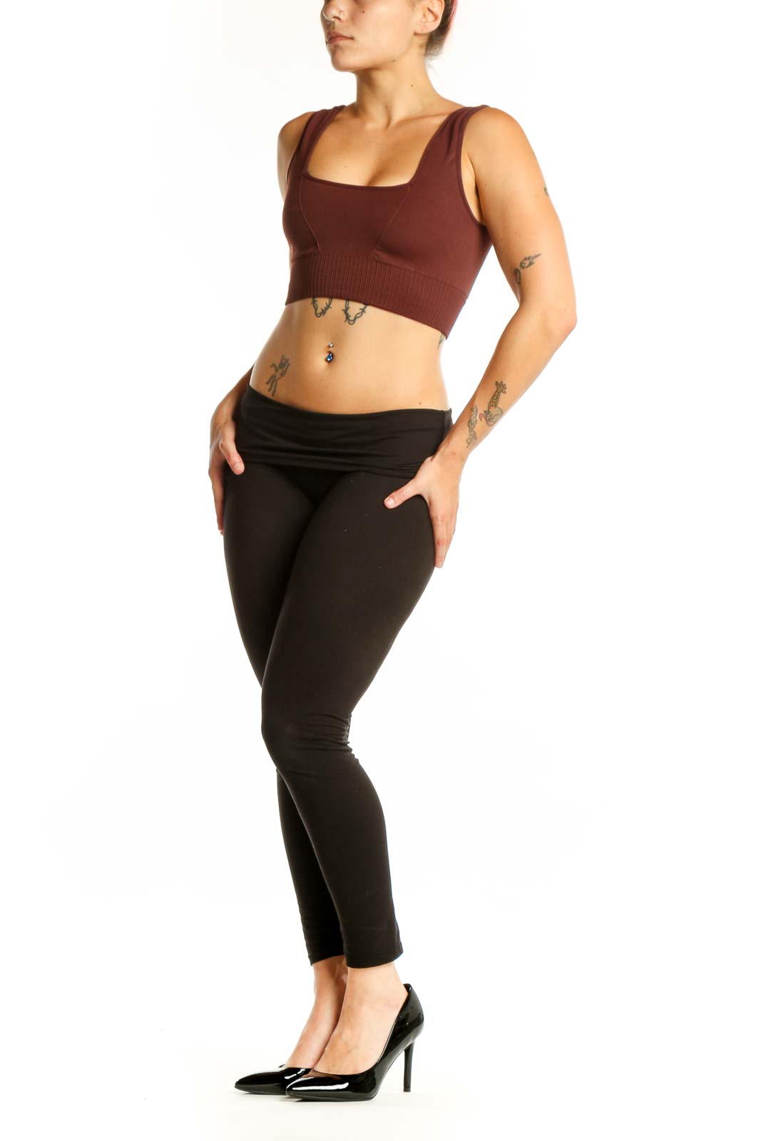Front view of burgundy ribbed sports bra tank top with square neckline and black leggings