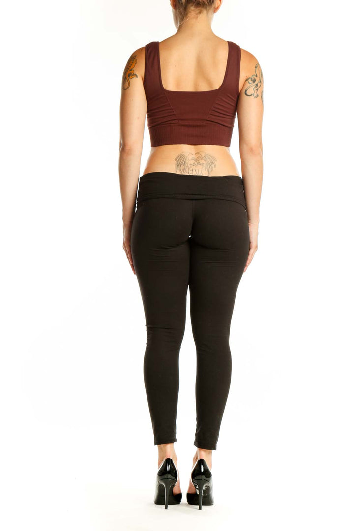 Back view of burgundy ribbed sports bra tank top showing supportive construction and fit