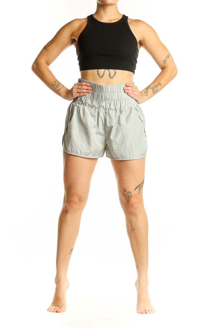 Sage green elastic waist athletic shorts front view on model