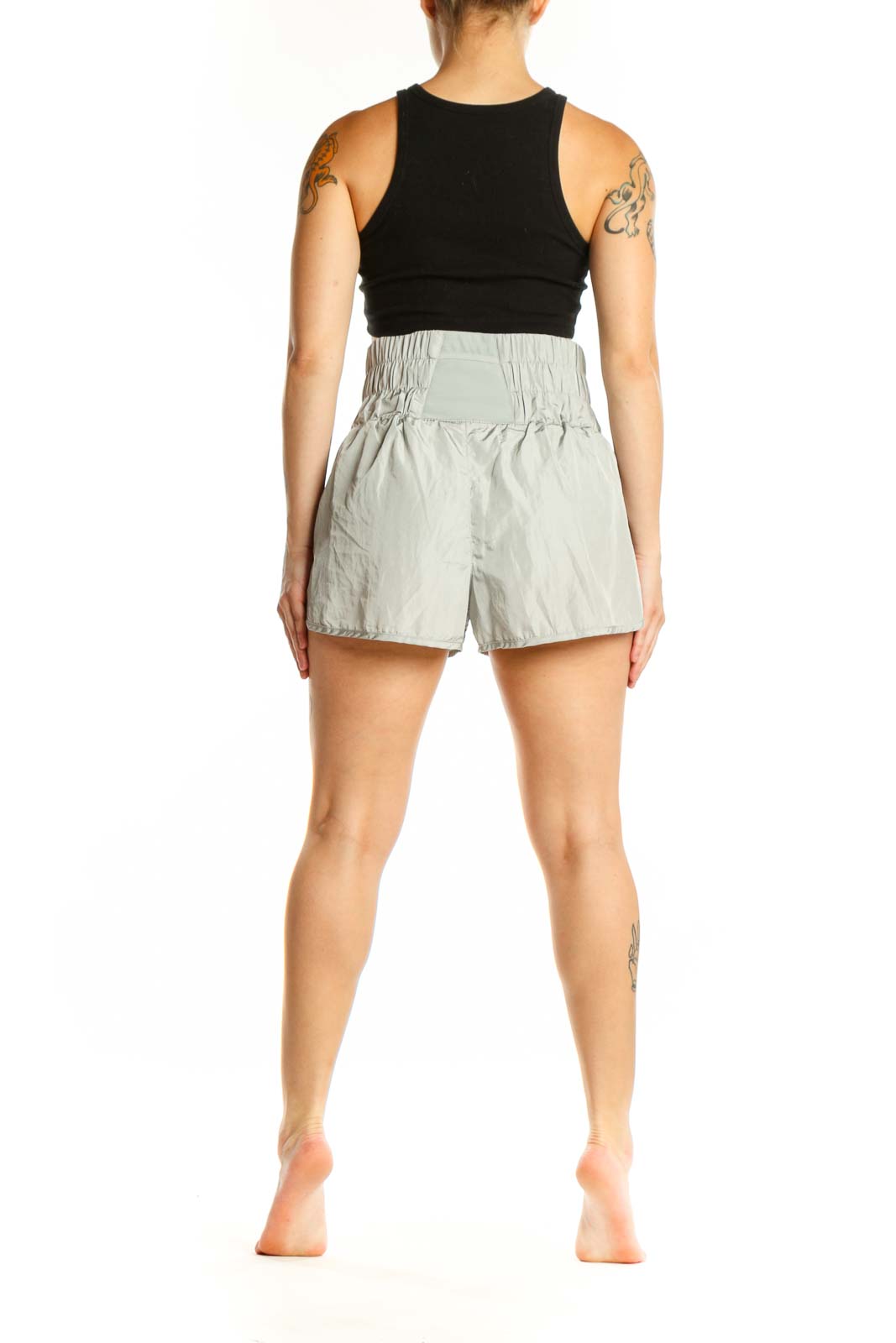 Sage green elastic waist athletic shorts back view on model