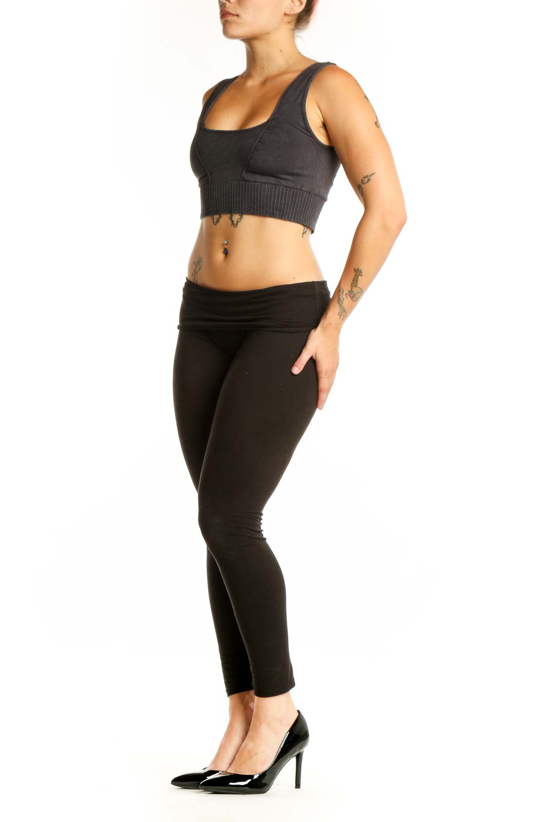 Black ribbed sports bra with square neckline and thick straps, front view on model