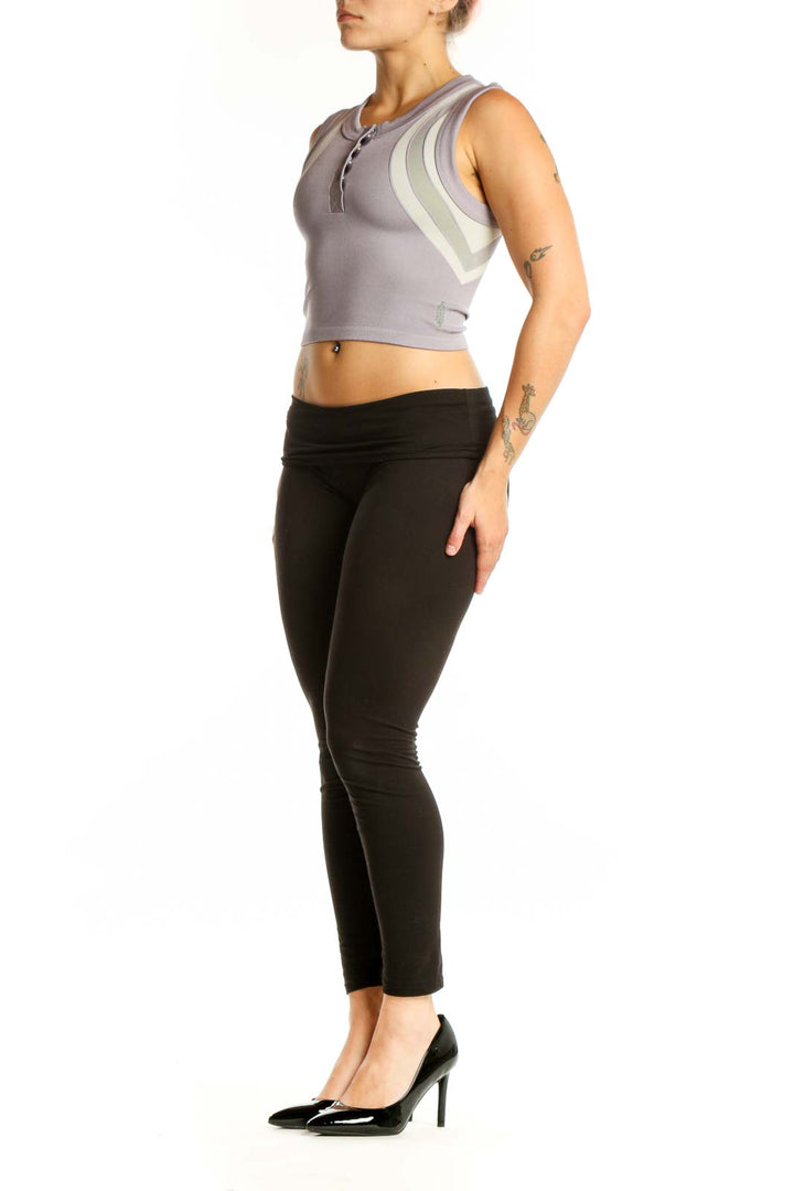 Gray striped crop tank top with cream vertical stripes and henley neckline, front view