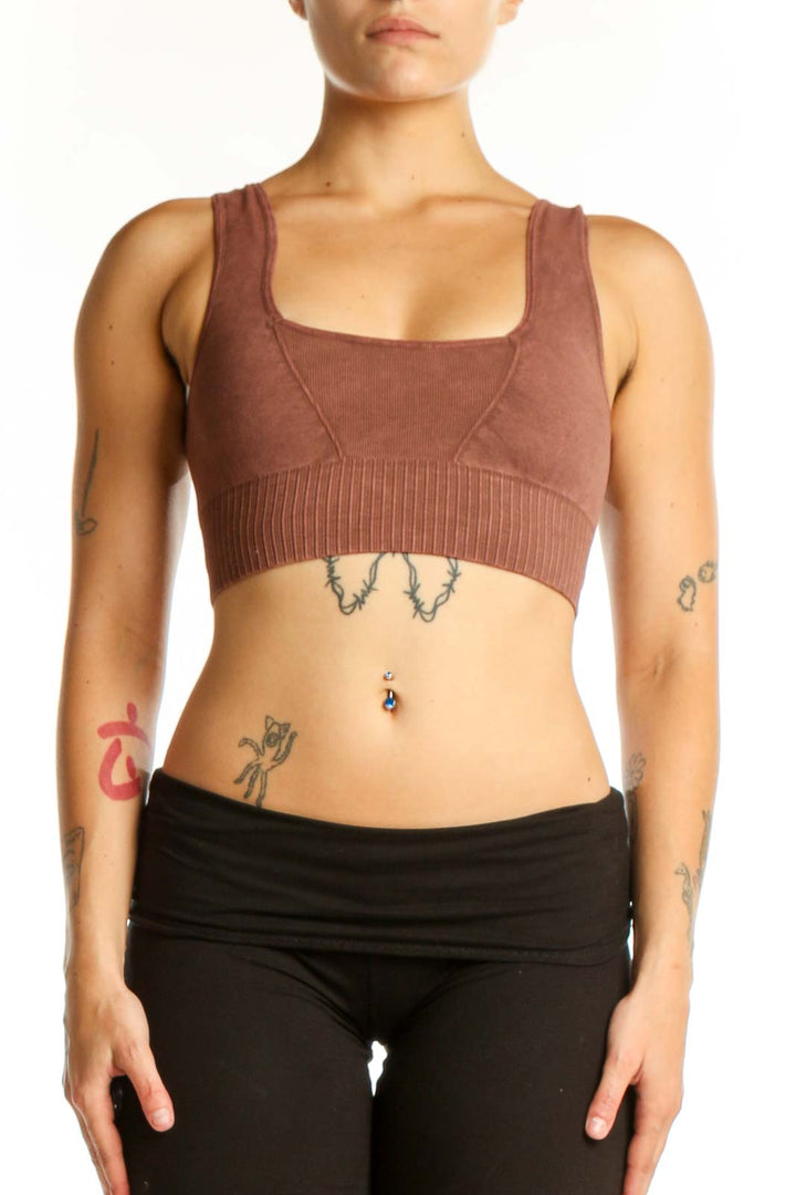 Burgundy ribbed sports bra with square neckline and black leggings, front view