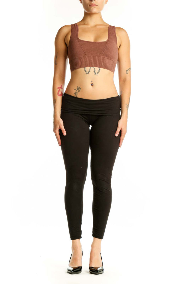 Burgundy ribbed sports bra with square neckline and black leggings, front view