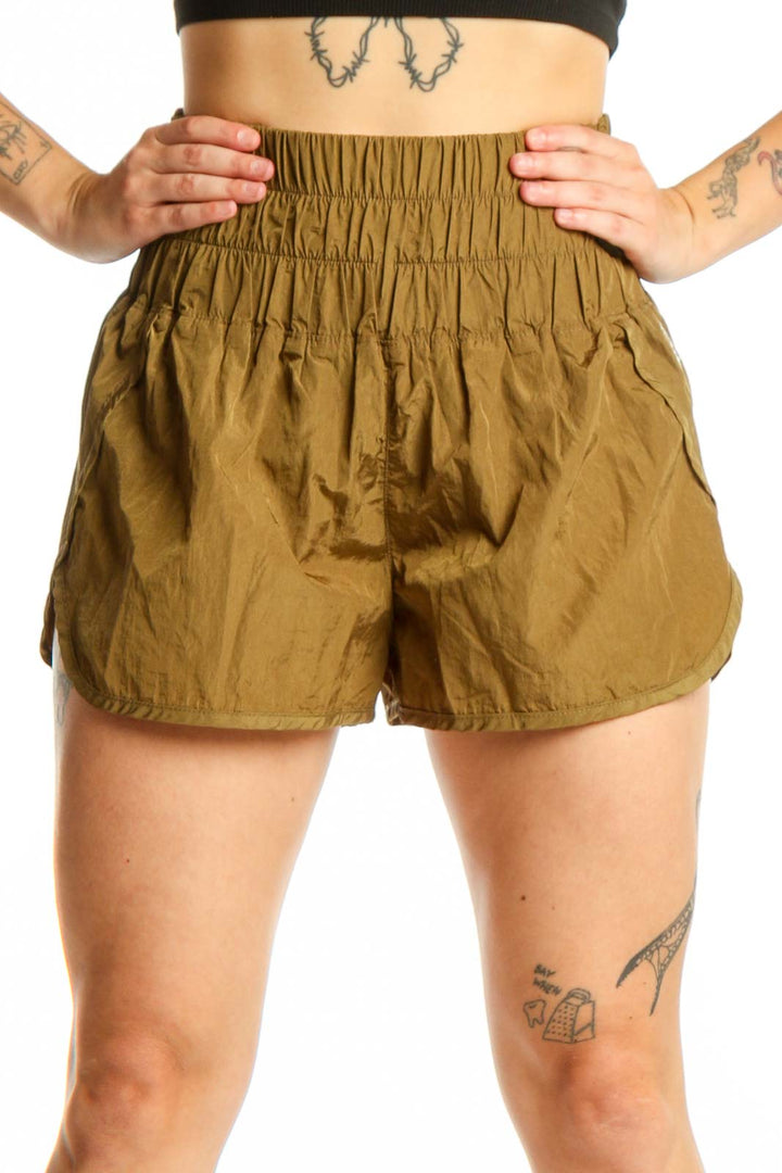 Olive nylon activewear shorts with high-waisted elastic waistband and bubble hem design, front view