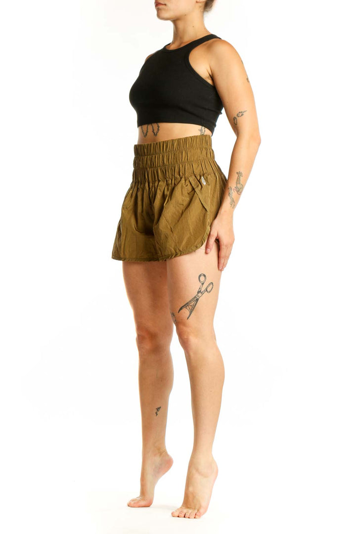 Olive nylon activewear shorts with high-waisted elastic waistband and bubble hem design, front view