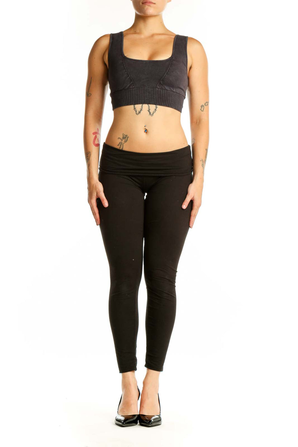 Black ribbed sports bra with square neckline and thick straps, front view on model