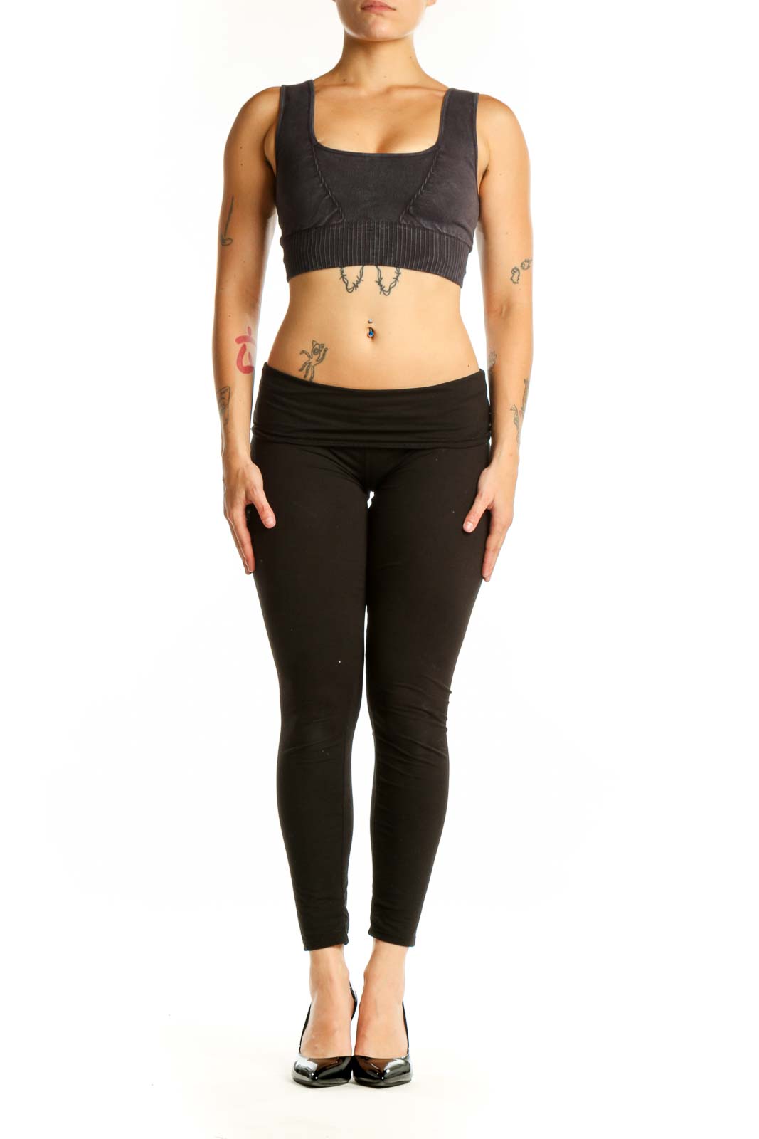 Black ribbed sports bra with square neckline and thick straps, front view on model