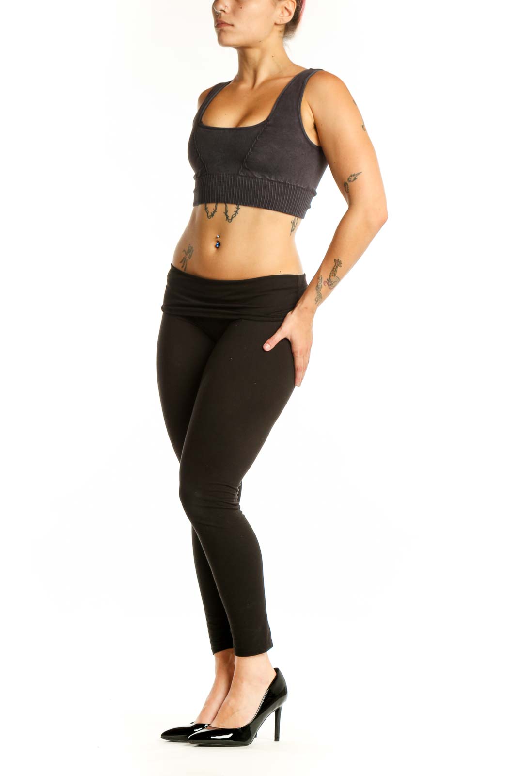 Black ribbed sports bra with square neckline and thick straps, front view on model