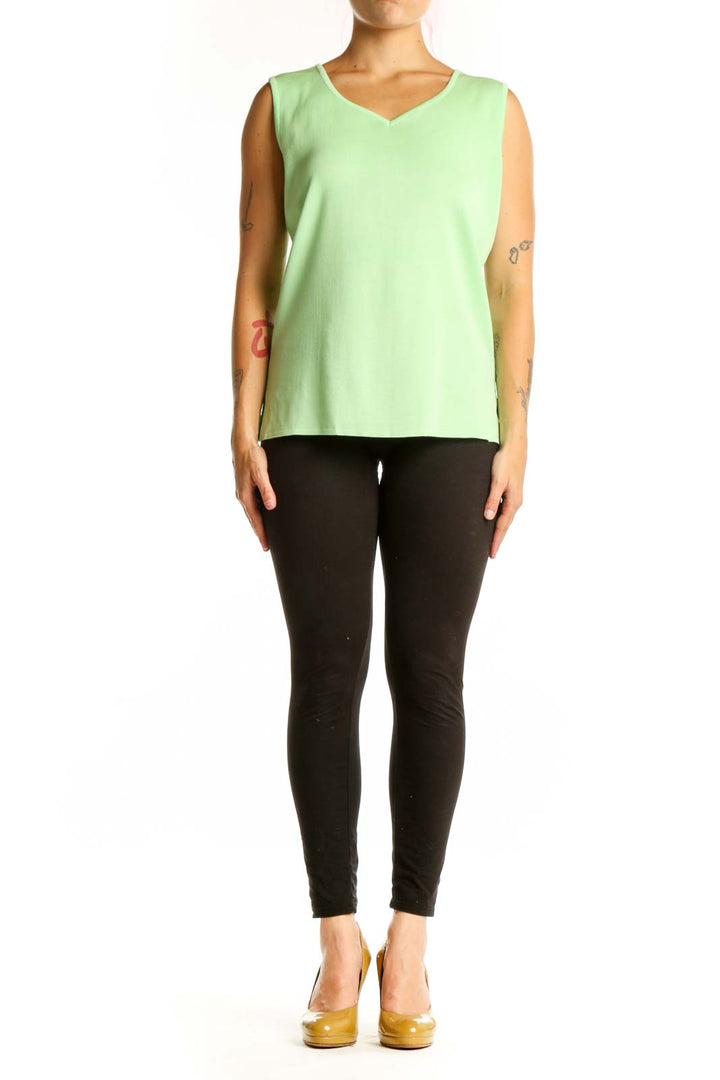 Green v-neck sleeveless knit tank top by MING WANG, front view on model