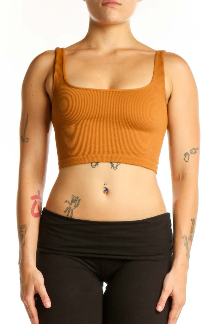 Orange ribbed crop tank top with square neckline, front view on model