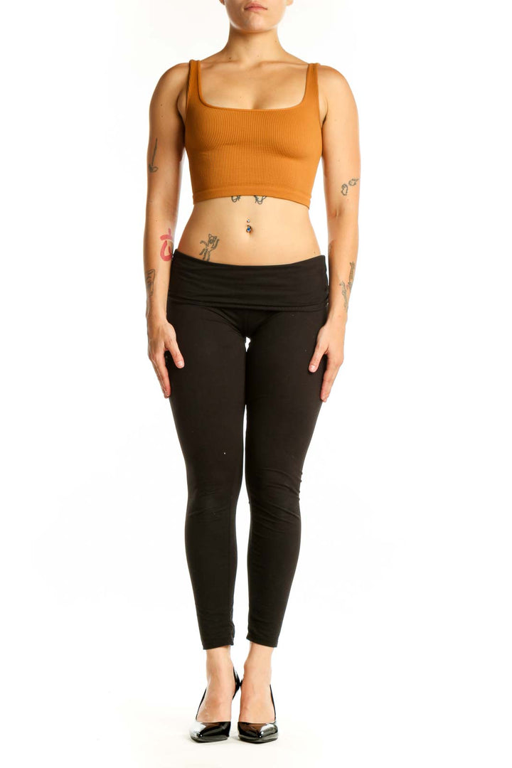 Orange ribbed crop tank top with square neckline, front view on model