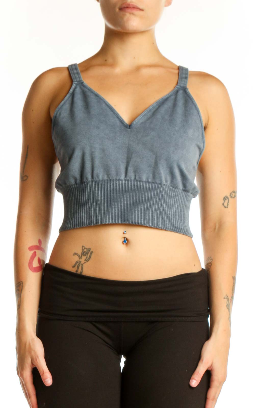 Blue ribbed crop tank top with V-neckline and spaghetti straps, front view