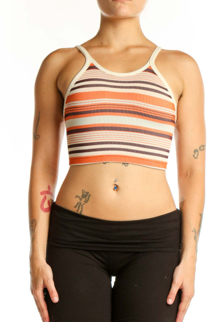 Front view of orange and white striped ribbed sports bra by Free People Movement, size XS