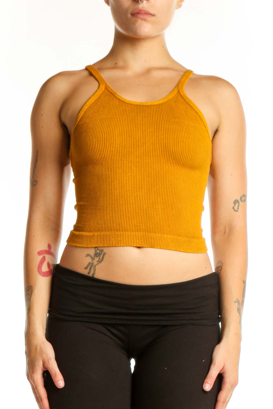 Gold ribbed crop tank top with spaghetti straps, front view on model