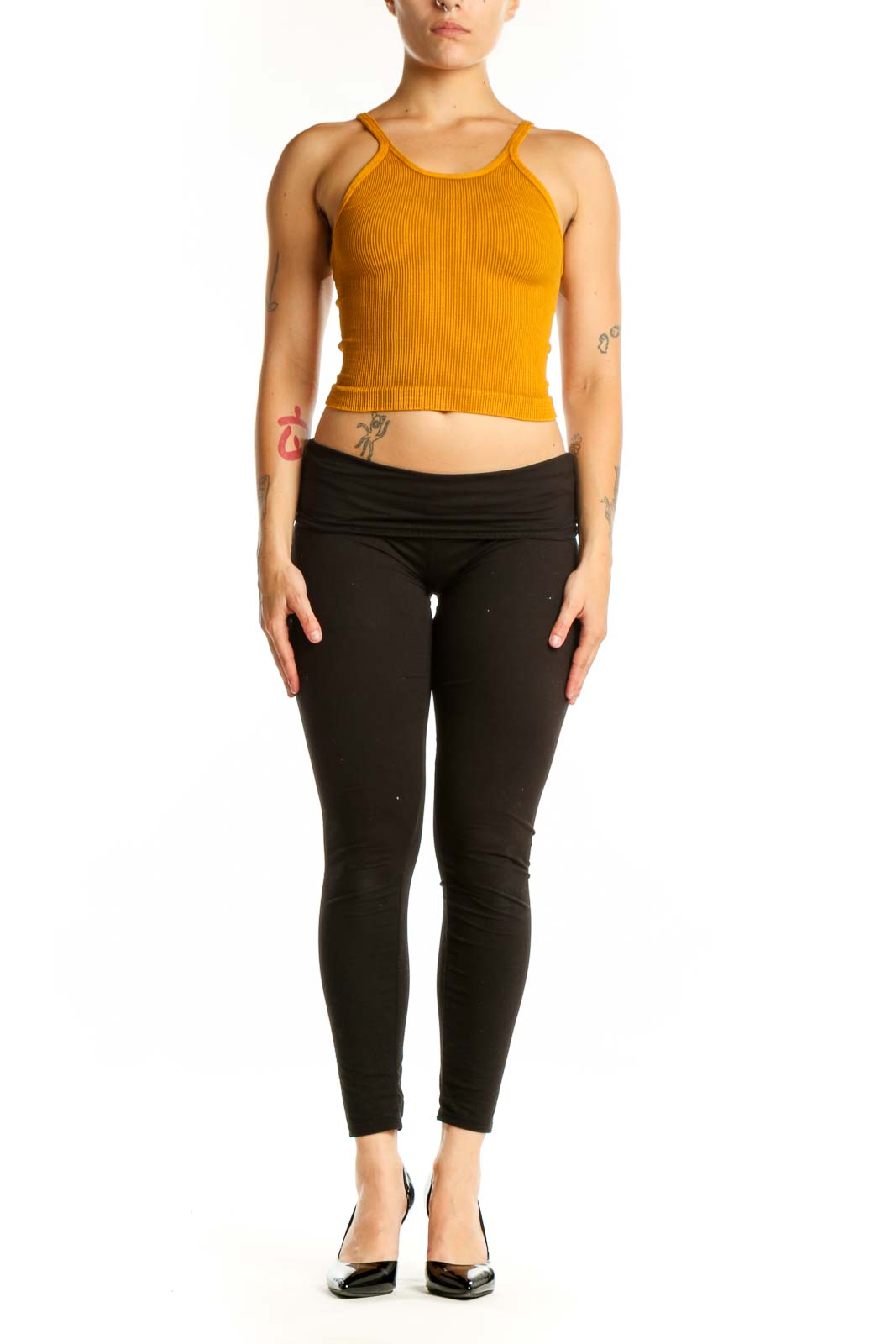 Gold ribbed crop tank top with spaghetti straps, front view on model