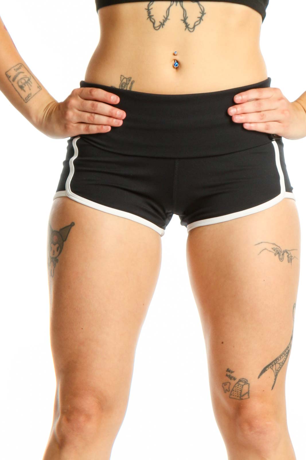 Black activewear shorts with white trim, high-waisted design, front view on model
