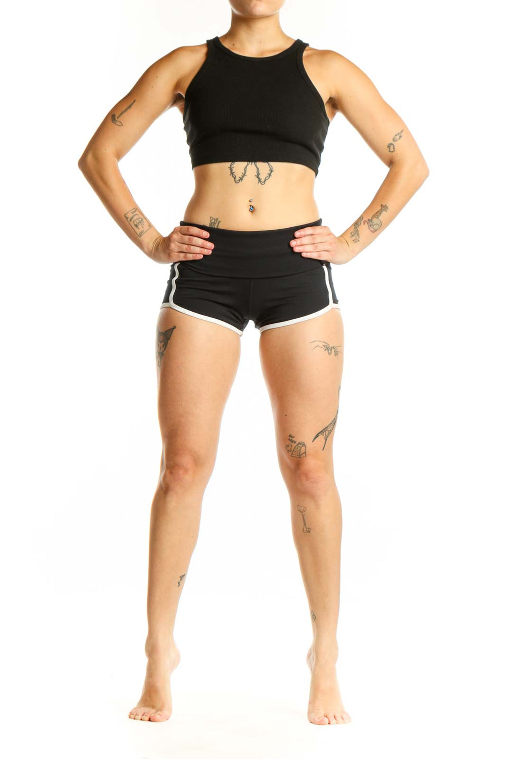 Black activewear shorts with white trim, high-waisted design, front view on model