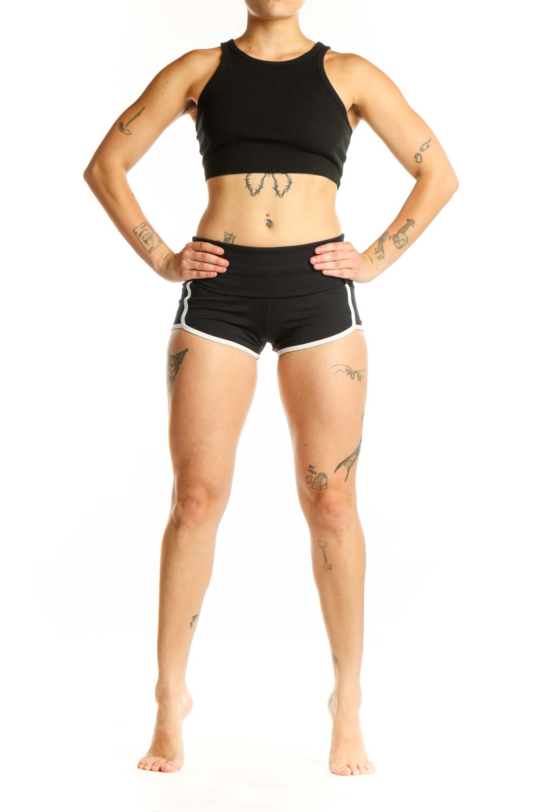 Black activewear shorts with white trim, high-waisted design, front view on model