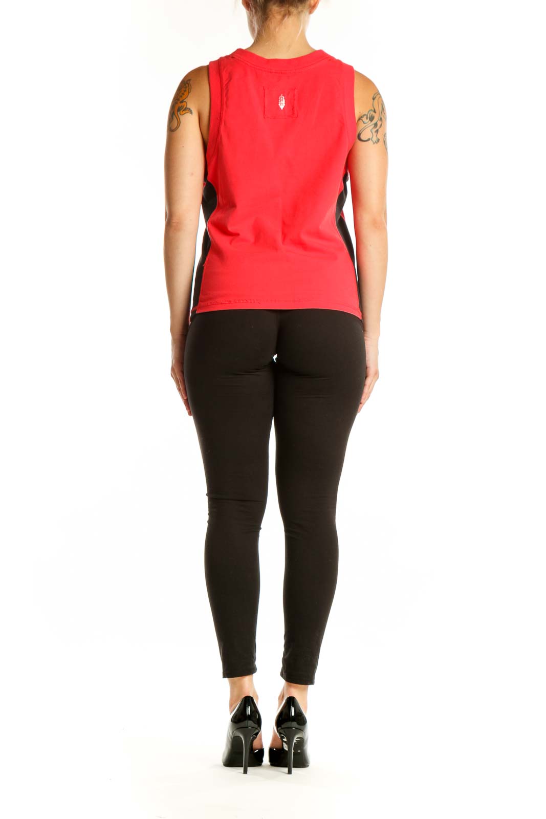 Red athletic tank top with black side panels, back view